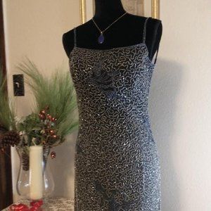 Full length women's black umbrae beaded dress.